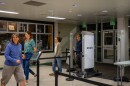 Families walk through the weapons detectors at Highland High, Oct. 10, 2023. Some families were at the school specifically to see the new machines at an open house, while others were at the school for a band concert but stopped to look at the detectors.