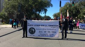 Members of the Martin Luther King, Jr. Commission of Florida lead the march from Gainesville City Hall to the Martin Luther King Multi-Purpose Center today. The march kicked off a week of events celebrating the life and legacy of Dr. King. (Melissa Smith/WUFT News)