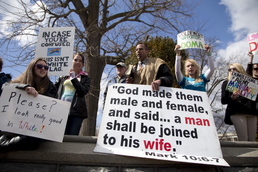 Allan Hoyle of North Carolina (center) protests gay marriage outside the Supreme Court.