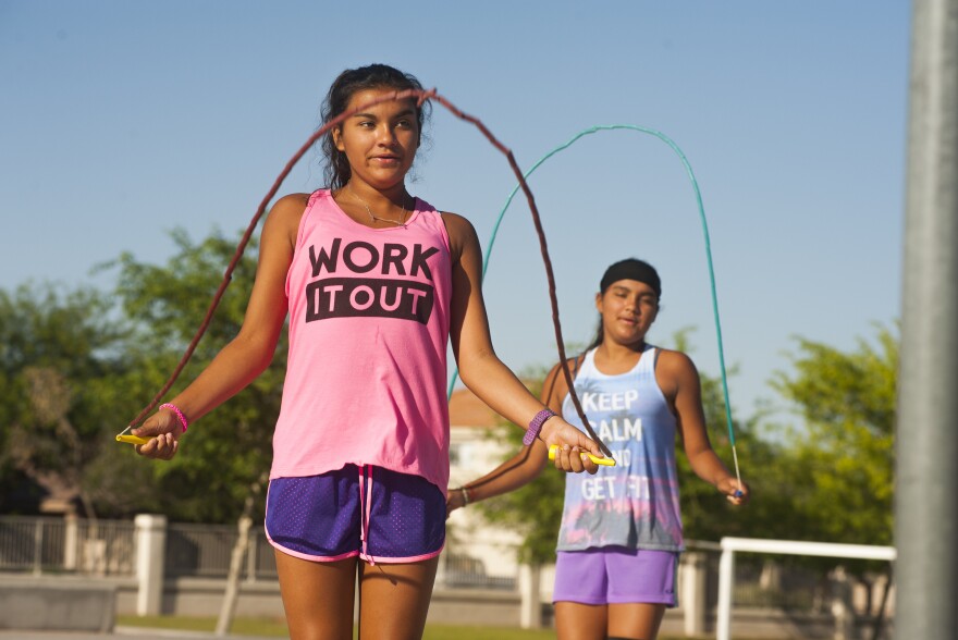 Kaprice Faraci (left) and her twin sister, Kassidy, joined the run club in third grade after seeing kids jog by. "We were like, 'Hey, we wanna do that,' " Kaprice says.