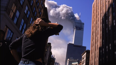 FILE: Shocked crowds of downtown Manhattanites observe the burning World Trade Center towers in New York City early September 11, 2001. Three hijacked planes crashed into major U.S. landmarks on the same day, destroying both of New York's twin towers and plunging the Pentagon in Washington into flames, in an unprecedented assault on key symbols of U.S. military and financial power.