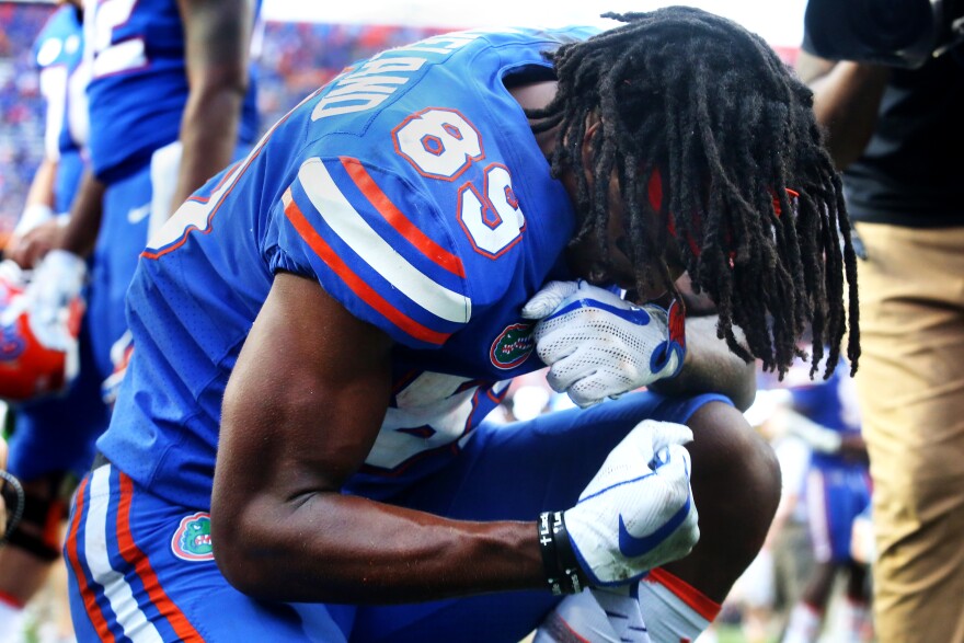 Gators wide receiver Tyrie Cleveland (89) takes a knee on the field of Ben Hill Griffin Stadium after making the game-winning touchdown during the first home game against the Tennessee Volunteers on Sept. 16, 2017. The Gators won 26-20 when Cleveland caught a 63-yard pass in the end zone with zero seconds left on the clock. (Emma Green/ WUFT News)