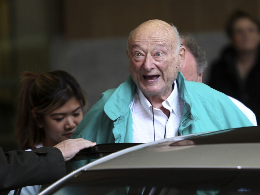 New York City Mayor Ed Koch says goodbye to reporters as he gets in his car after being released from a New York hospital on Dec. 12, 2012.