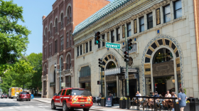 An Asheville Fire Department response vehicle drives through the city’s downtown