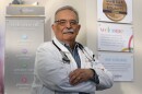 Dr. William Valenti, who has championed HIV care in Rochester for more than 40 years, is retiring from his career at Trillium Health, where he has overseen programs aimed at ending the HIV epidemic. Dr. William Valenti holds his self-published book, A Matter of Urgency, a collection of patient stories and personal reflections that chronicle the HIV epidemic.