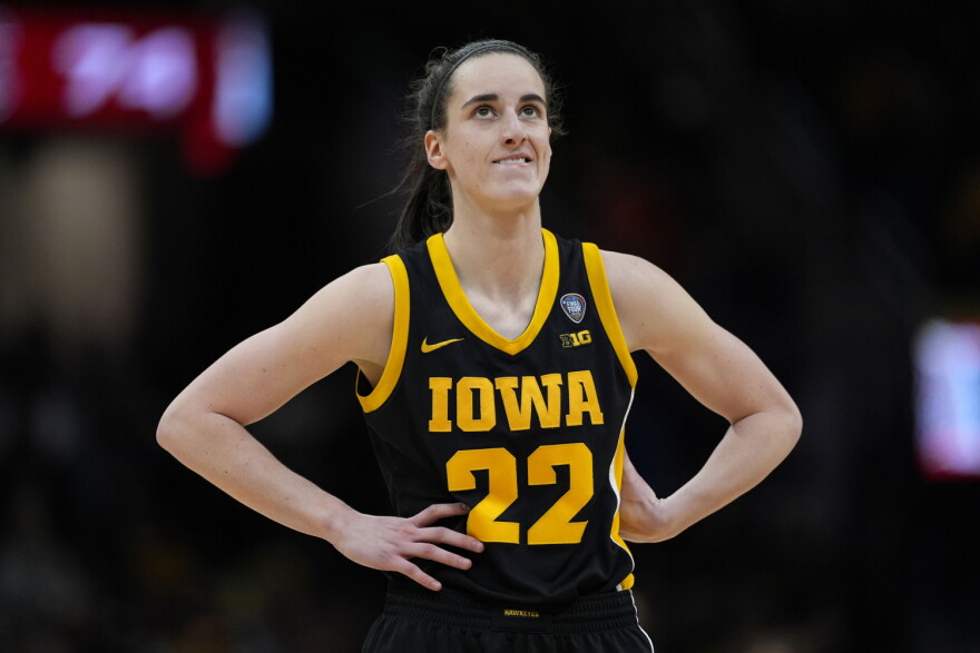 Iowa guard Caitlin Clark stands on the court during the second half of the Final Four college basketball championship game against South Carolina in the women's NCAA Tournament, Sunday, April 7, 2024, in Cleveland.