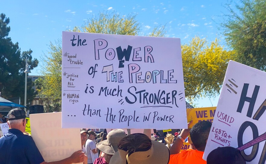 Demonstrators at the Arizona Capitol protesting and marching against actions taken by the Trump administration on May 1, 2025.