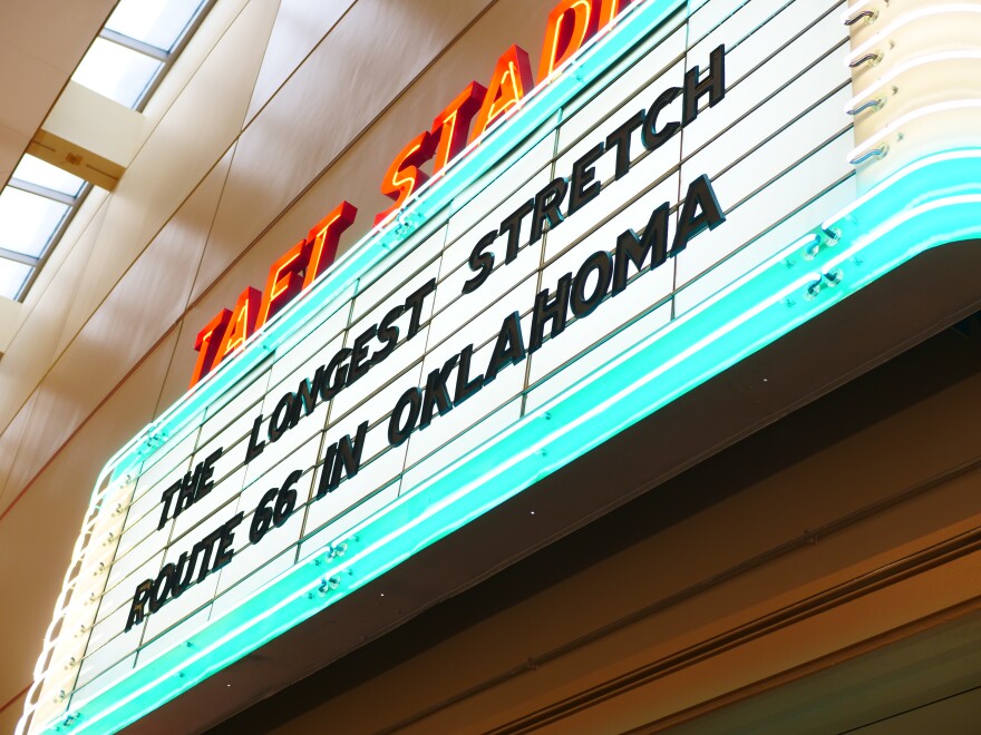A restored sign from Taft Stadium in Oklahoma City hangs above the entrance to the exhibit.