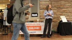 Christa Bender, a census recruiting assistant, stands in the University of Colorado, Boulder food court during a hiring fair on Feb. 3, 2020. Bender was one of dozens of recruiters in Colorado looking to find qualified census takers for the 2020 count.