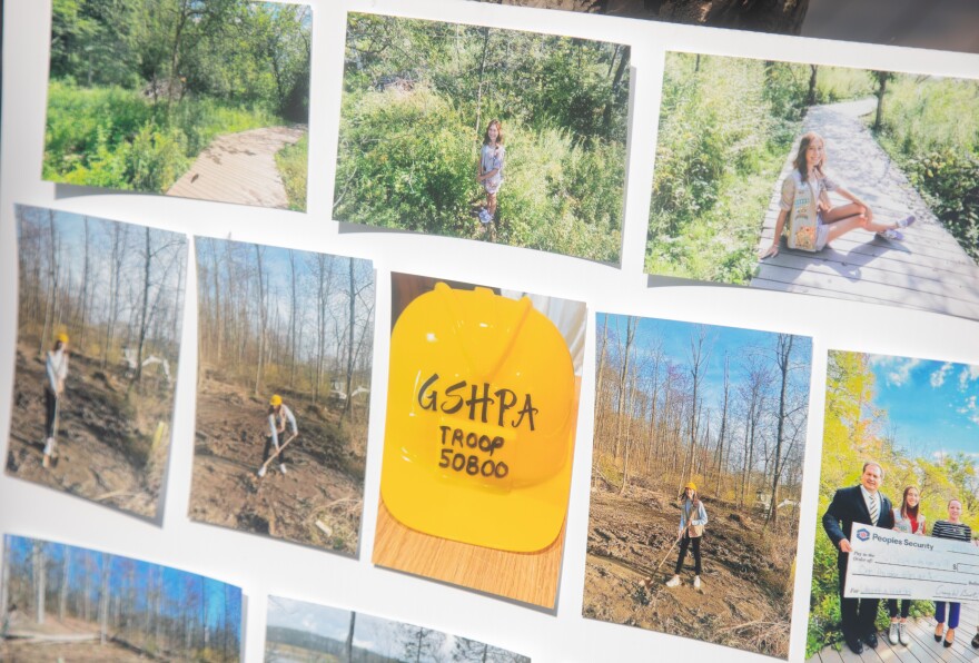 Photos on a poster show some of the progress Faith Bennett made on the labyrinth at Hillside Park.