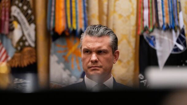 Defense Secretary Pete Hegseth listens as President Donald Trump speaks during a Cabinet meeting at the White House, Tuesday, Dec. 2, 2025, in Washington. (AP Photo/Julia Demaree Nikhinson)