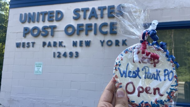 A cookie that says "Keep West Park PO Open." The West Park post office will close temporarily, and many residents fear the closure could be permanent.