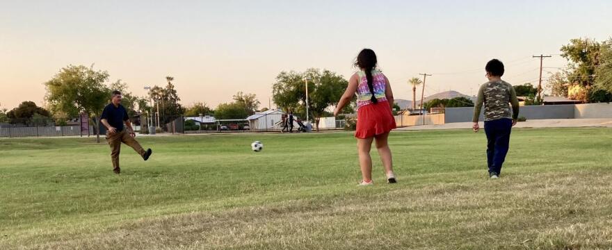 Alberto Valle and his children play soccer at Homestead Park on Sept. 7, 2021.