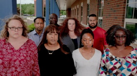 Parents and leaders stand at the Suffield High School. About 40 parents and residents created a group and meet once a week to discuss goals and actions plans to create policy changes to help eradicate racism in the school system.