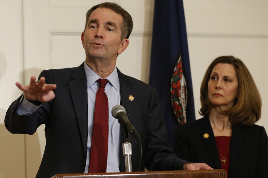 Virginia Gov. Ralph Northam, left, gestures as his wife, Pam, listens during a press conference in the Governors Mansion at the Capitol in Richmond, Va., Saturday, Feb. 2, 2019.  Northam is under fire for a racist photo that appeared on his page in his college yearbook. (Steve Helber/AP)