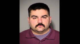 IMPD Officer Christopher Dickerson was arrested on three felony counts.