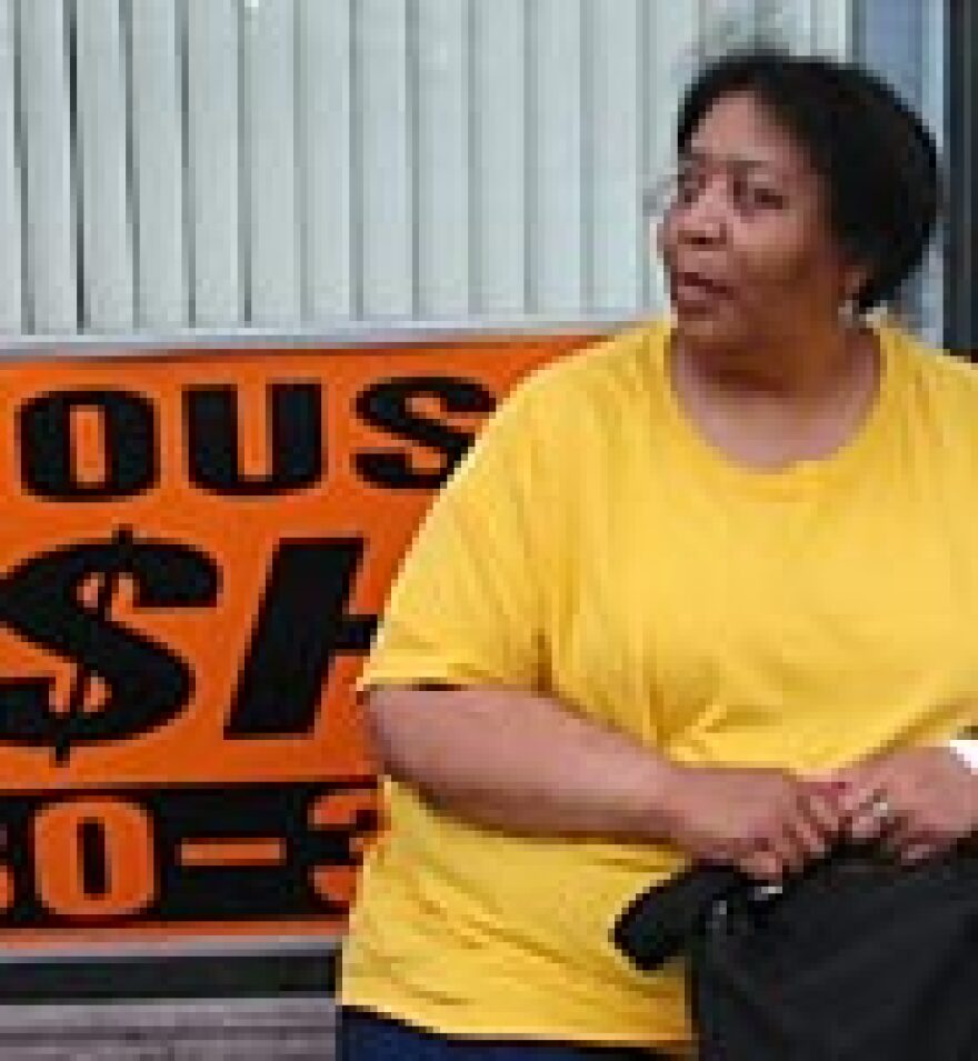 Marzs Mata waits for the third and final bus of her three-hour commute home from her job in the suburbs to downtown Detroit.