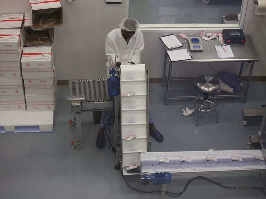 Meds and Food for Kids started making enriched peanut butter in 2003 by grinding peanuts and mixing the ingredients by hand. Today, it has a modern factory.