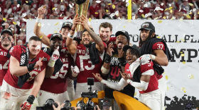 Indiana holds the trophy after their win against Miami in the College Football Playoff national championship game, Monday, Jan. 19, 2026, in Miami Gardens, Fla.