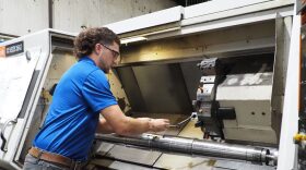 A Critical Components Aerospace worker manufactures a landing gear axel at at the company's Oklahoma City facility. The company, which has partnered with the state's ACES Program, produces flight and space components.