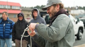 A fisherman demonstrates one of the knots he uses for fishing. There's some disagreement to how certain knots are tied.