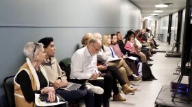 Audience overflow extends through a hallway at an Oklahoma State Board of Education meeting Jan. 28, 2025, at the state Department of Education in Oklahoma City.