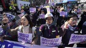 Members of the Korean Confederation of Trade Unions march during a rally marking International Women's Day in Seoul, South Korea. (Ahn Young-joon/AP)