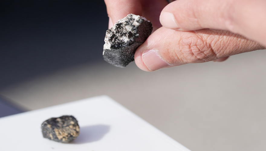 Meteorite hunter Roberto Vargas, of Connecticut, displays one of the meteorites he found in Sharon Center, Ohio, Thursday, March 19, 2026, after a meteor crashed March 17.