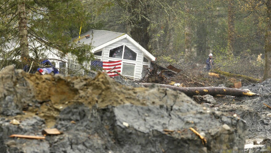 A house sits among other debris following the Oso landslide in March 2014.