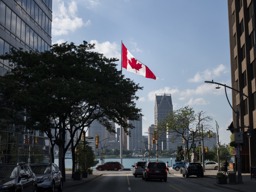 Canada legalized recreational marijuana in this month, but Canadians can find themselves barred from entering the U.S. if they say they've used it. A Canadian flag flies in Windsor, Ontario, in June, with the Detroit skyline visible behind it.