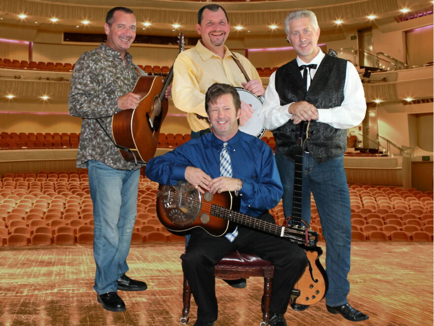 The Farm Hands.  In photo, in back left to right, Keith Tew, Don Hill, Daryl Mosley; seated, Tim Graves