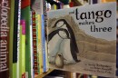FILE - A copy of the book "And Tango Makes Three" is photographed on a bookstore shelf in Chicago, Nov. 16, 2006. Months after access to the popular children's book about a male penguin couple hatching a chick was restricted at school libraries because of Florida's so-called “Don't Say Gay” law, a central Florida school district says it has reversed that decision. The complaint challenged the restrictions and Florida's new law prohibiting classroom discussion about sexual orientation or gender identity in certain grade levels.
