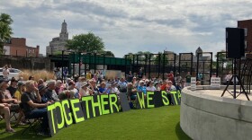 The crowd that attended the "Stand Up for Each Other" rally Sunday, May 31 at MLK Park, Davenport, with the front row signs spelling out "Together We Stand."