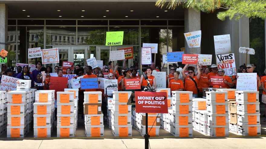 Supporters for Prop 2 in Lansing, Mich. dropping off signatures for the ballot measure in May. (Photo courtesy of Michiganders for Money Out of Politics)