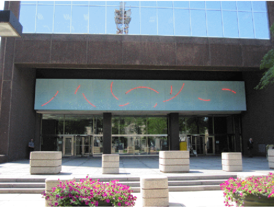 The artwork "Red Neon Circle Fragments on a Blue Wall 1978" on the front of the Walter H. Rice Federal Building and U.S. Courthouse in Dayton.