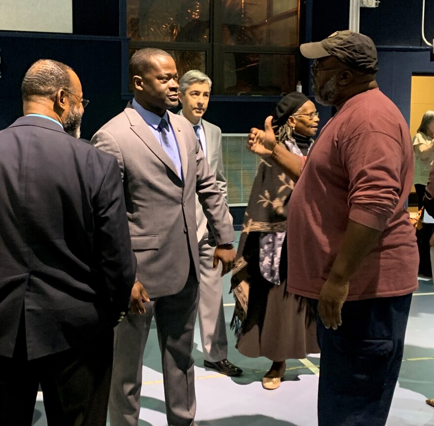 Gilliam (in the grey suit) spoke with Tallahassee residents during a meet and greet as one of the top three candidates for the city's chief of police.