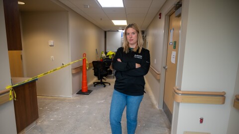 Catherine Hillestad, the CEO of Adair County Memorial Hospital in Greenfield, Iowa, stands in the medical-surgical unit. A tornado in May damaged the entire hospital, shutting it down for months for repairs.