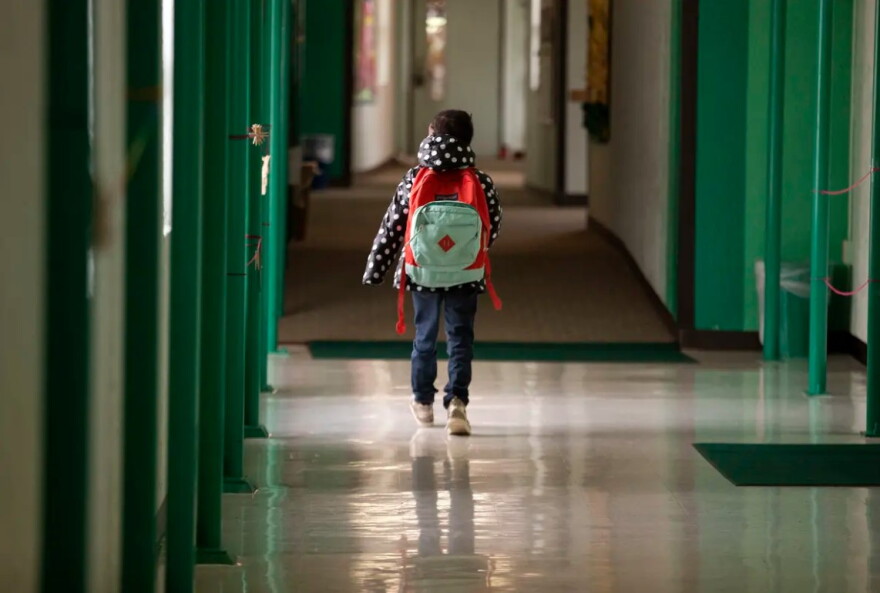 A student walks down the hallway at Cactus Elementary School.