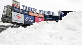 Snow is seen piled up on the field before the Pinstripe Bowl NCAA college football game between Clemson and Penn State at Yankee Stadium Saturday, Dec. 27, 2025, in New York. (AP Photo/Adam Hunger)