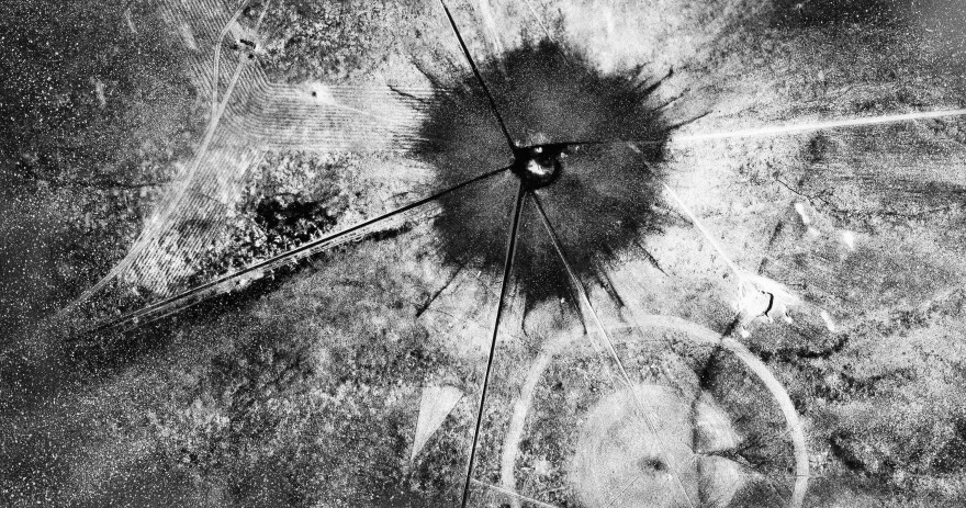 FILE - This July 16, 1945, photo shows an aerial view after the first atomic explosion at Trinity Test Site, N.M. U.S. senators from New Mexico and Idaho are making another push to expand the federal government’s compensation program for people exposed to radiation following uranium mining and nuclear testing carried out during the Cold War. Downwinders who live near the site where the world’s first atomic bomb was tested in 1945 as part of the top secret Manhattan Project would be among those added to the list. (AP Photo, File)