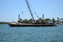 The barge from the vessel collision near Hibiscus Island, July 28, 2025. Coast Guard Sector Miami crews are investigating the potential causes of the collision.