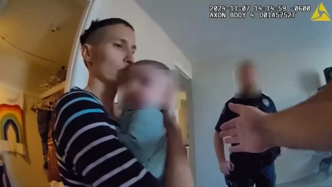 An image taken from body camera footage released by Independence Police show Maria Pike holding her daughter Destinii Hope.