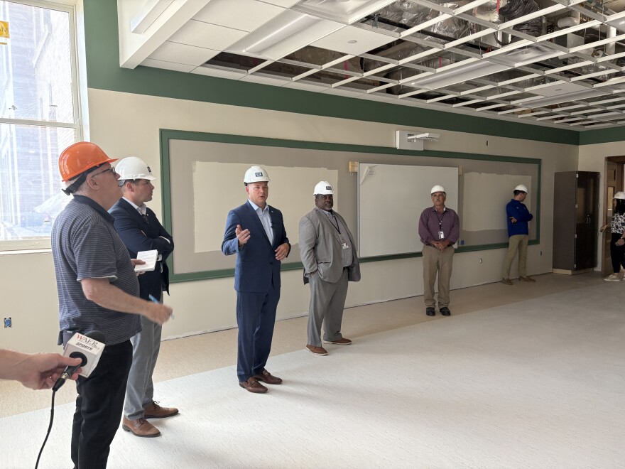Mayor Ben Walsh, County Executive Ryan McMahon, SCSD Superintendent Anthony Davis, and county facilities commissioner Archie Wixson stand in one of the science rooms on the second floor.