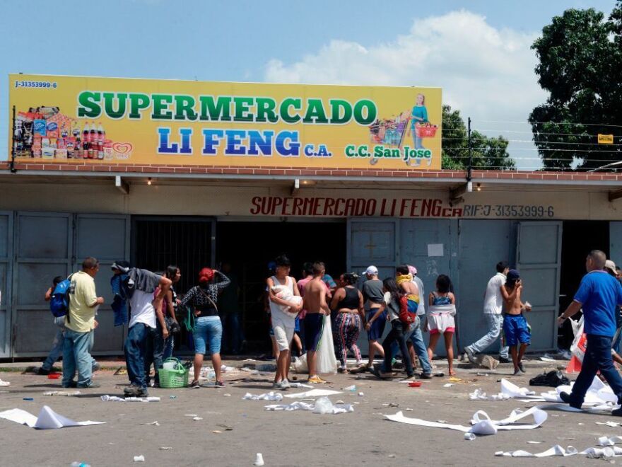 The helicopter incident in Caracas capped a volatile 24 hours that began with widespread looting in the coastal city of Maracay on Monday night.