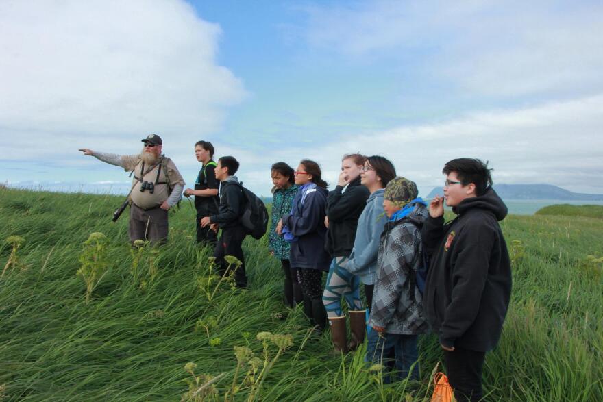 Terry Fuller leads Bristol Bay middle school students on a hike at Cape Peirce. (Photo by Isabelle Ross/KDLG)