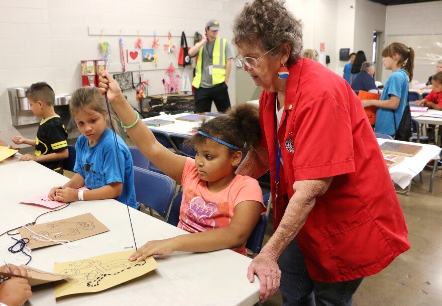 Fay Jones, 83, teaches a craft project. 