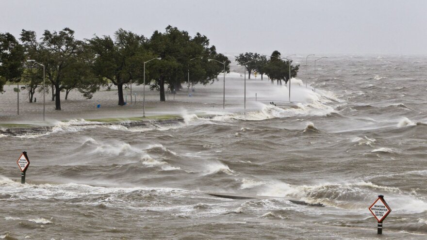 A storm surge causes tides to quickly rise while rough waves pound the concrete seawall along the shores of Lake Pontchartrain. Hurricane Isaac made landfall along the Gulf Coast and now threatens New Orleans.