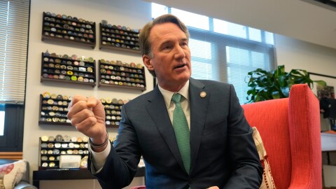 Virginia Gov. Glenn Youngkin gestures during an interview in his office at the Capitol Wednesday Dec. 10, 2025, in Richmond, Va.