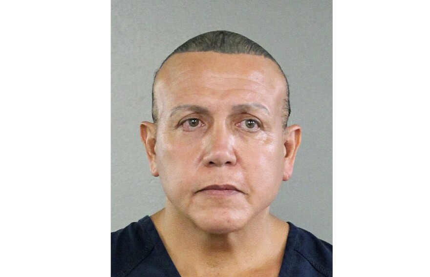 In this undated photo released by the Broward County Sheriff's office, Cesar Sayoc is seen in a booking photo, in Miami. Federal authorities took Sayoc, 56, of Aventura, Fla., into custody Friday, Oct. 26, 2018 in Florida in connection with the mail-bomb scare that earlier widened to 12 suspicious packages, the FBI and Justice Department said. (Broward County Sheriff's Office)