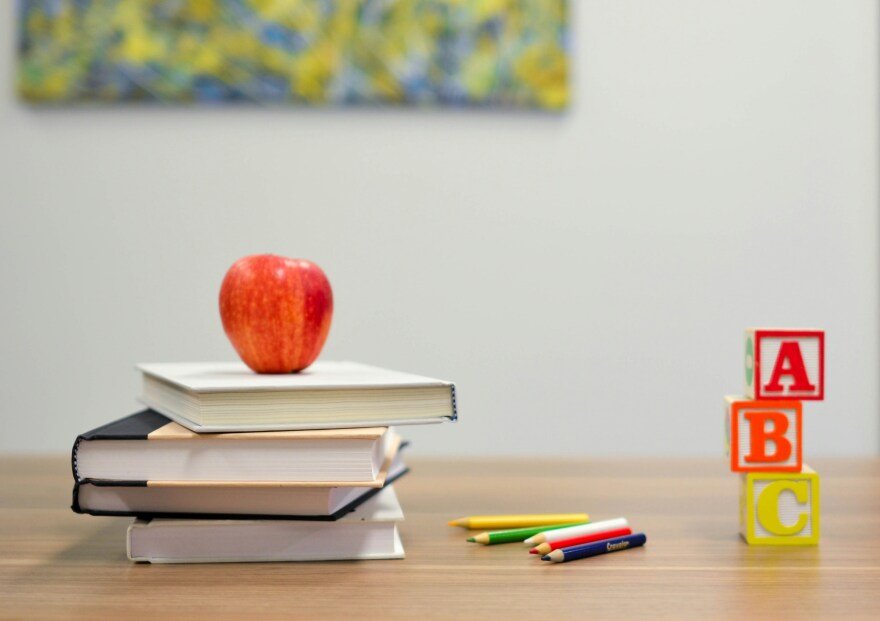 Teacher desk with books